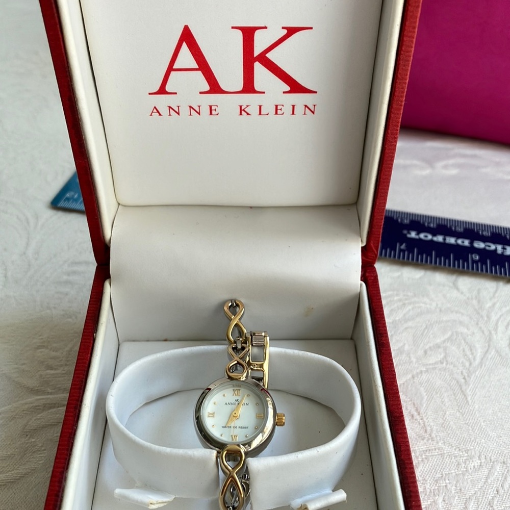 Never worn Anne Klein bracelet watch. Dainty mix of silver and gold tone chain.